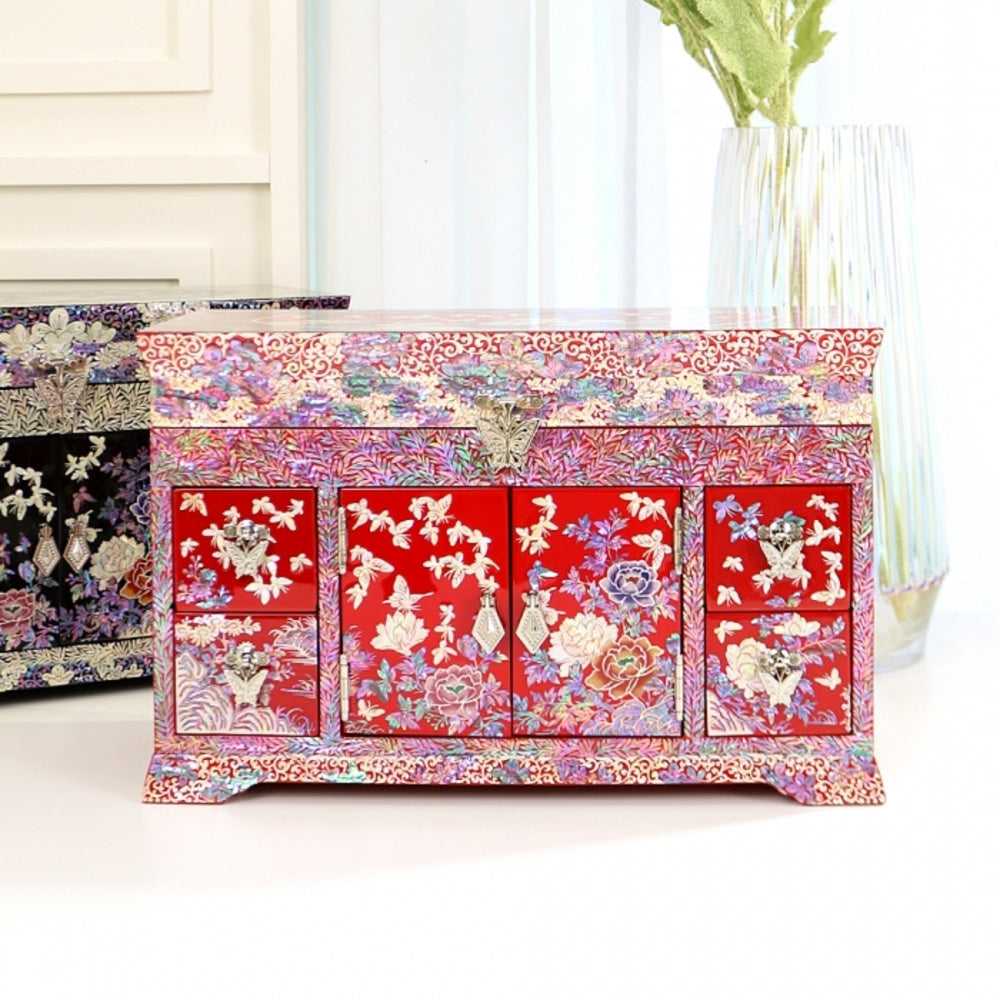 Red lacquer Korean chest with two centre doors and side drawers, peonies and dense arabesque scrollwork inlaid in mother-of-pearl across every face