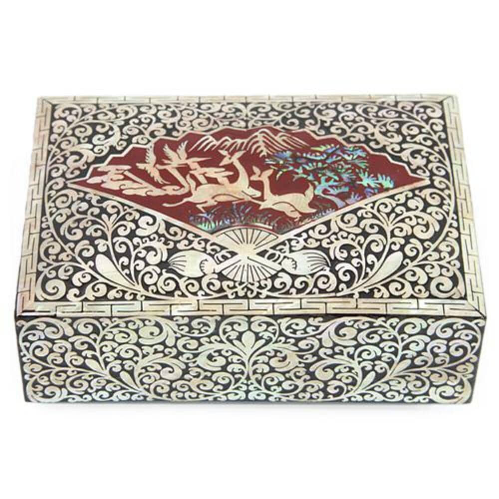 Black lacquer Korean card case covered in dense mother-of-pearl scrollwork, with a red fan-shaped panel on the lid holding deer, cranes, pine and mountains