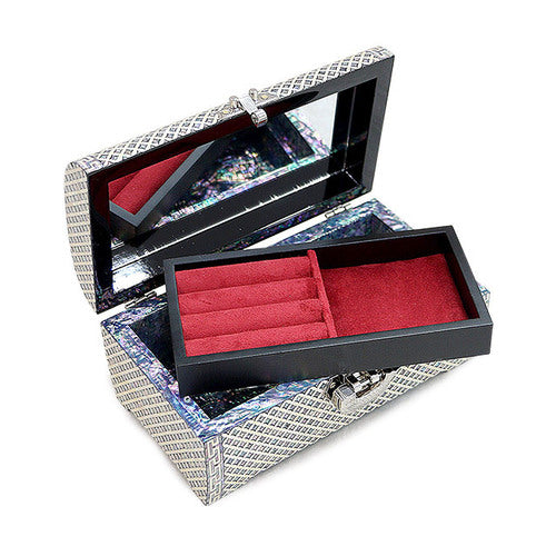 Removable compartment tray above the lower storage area of the Seven Treasures jewelry box