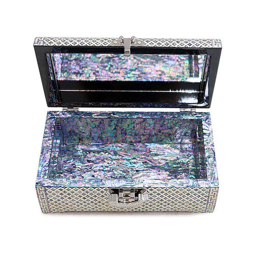 Mother-of-pearl-lined lower storage area and mirrored lid of the Seven Treasures jewelry box