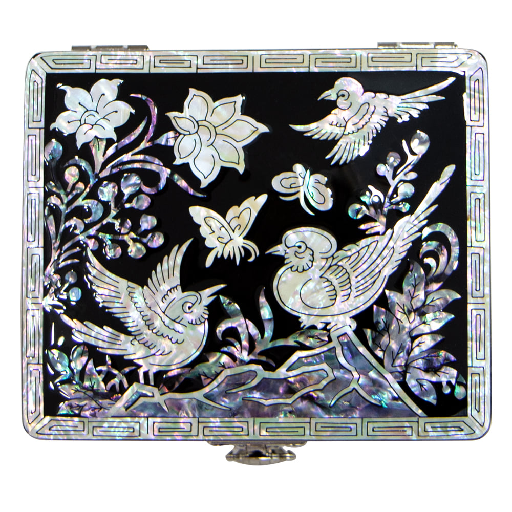 Mother-of-pearl jewelry box shown in a room setting