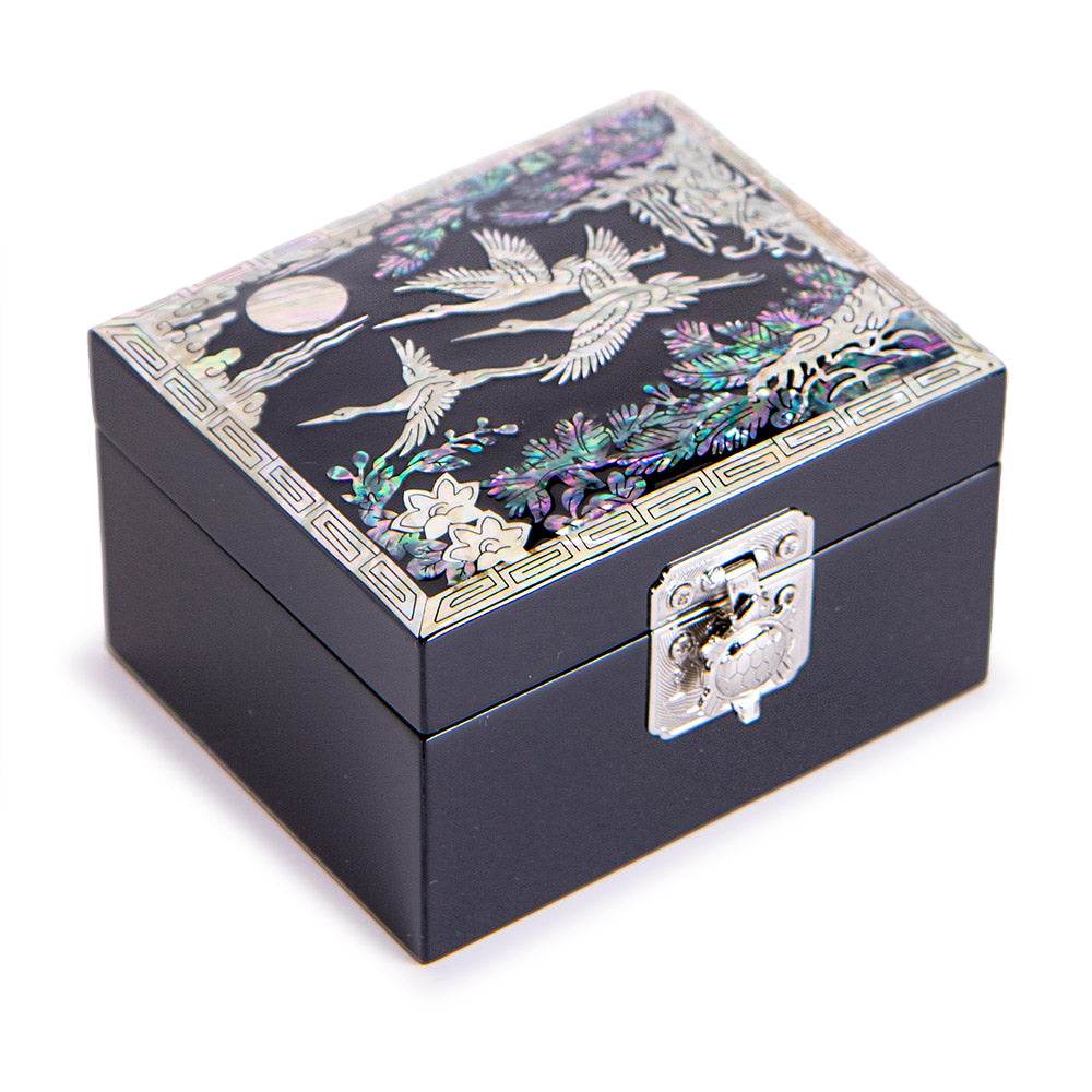 Jewelry box with lid open showing red velvet lining and ring roll